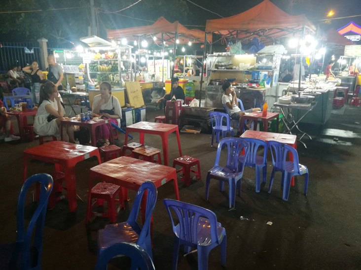 small tables and chairs in son tra market that work during the night