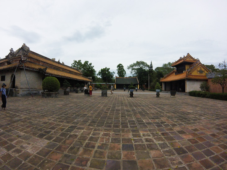 open area surrounded by building in tu duc tomb hue