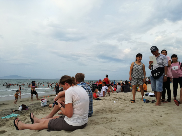 people taking pictures of us in da nang beach