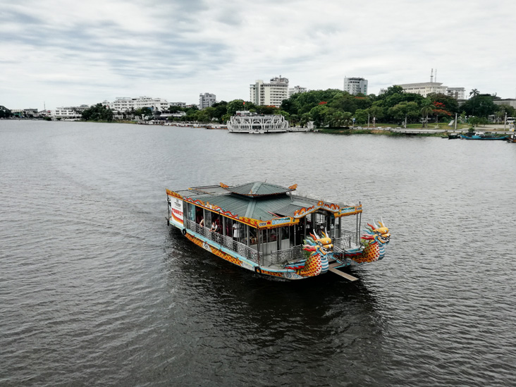 a ship with dragons on the perfume river in hue