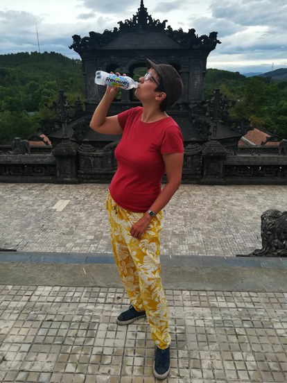 drinking isoctonic drinks in da nang in a hot day