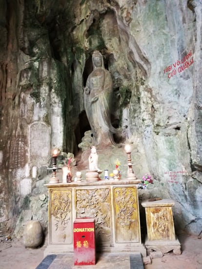 lady buda with an altar in da nang marble mountain