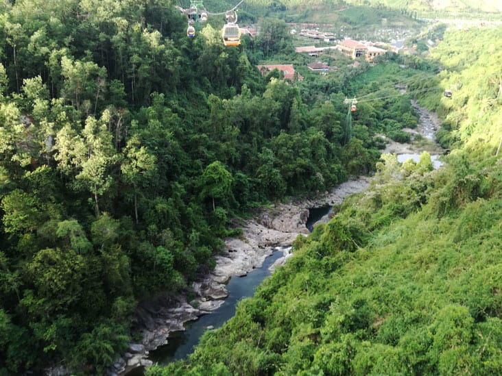 a river in the middle of the mountains in ba na hills da nang