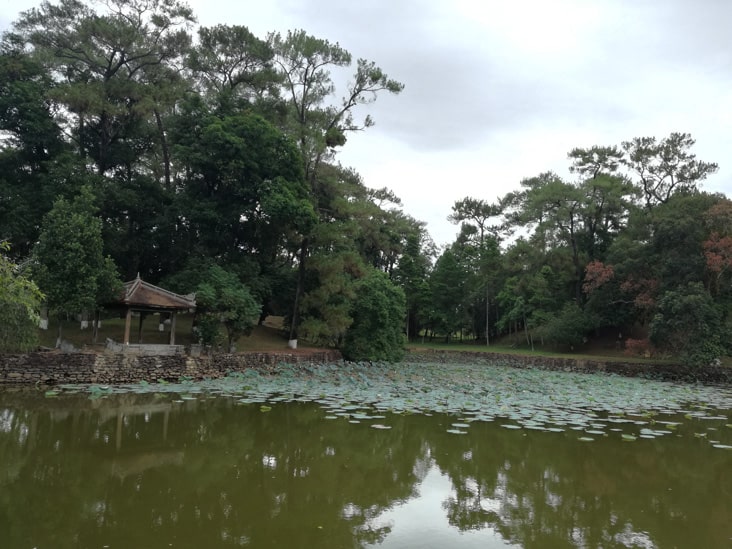 the lake in Minh Mang surrounded by green areas