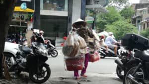 vietnamese lady in ho chi minh catches the attention of tourist people around