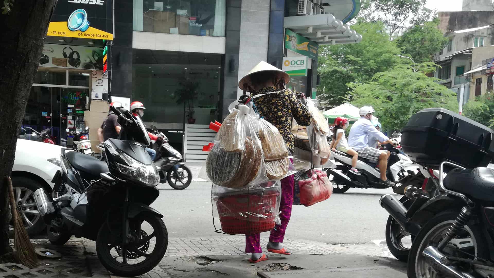 vietnamese lady in ho chi minh catches the attention of tourist people around